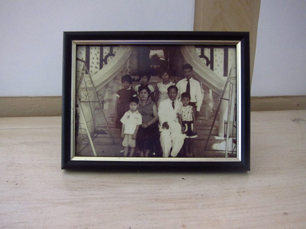 Portrait of former tenants, the Lim family which shows some of the original front entrance (photo courtesy of the Lim family)