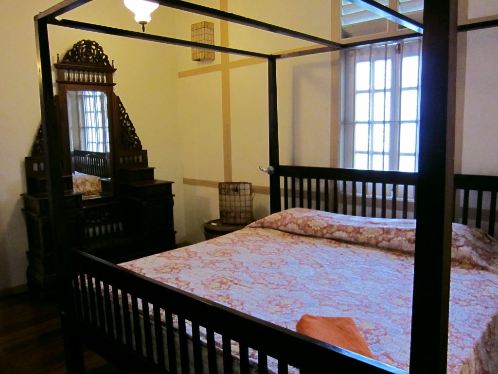 Wooden four poster king bed